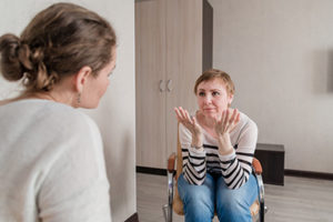 a woman discusses an anxiety treatment program in ca with a therapist