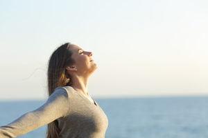 a woman stretches as she thinks about a heroin detox program at a heroin detox center in ca