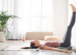 a woman practices yoga as one of her stress management techniques