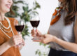 two mothers drink together as part of wine mom culture